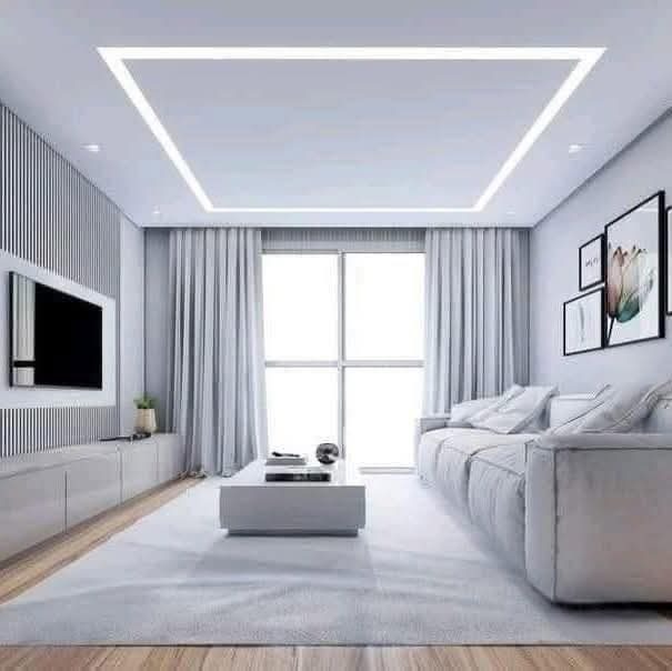 Living room with cove-lit false ceiling