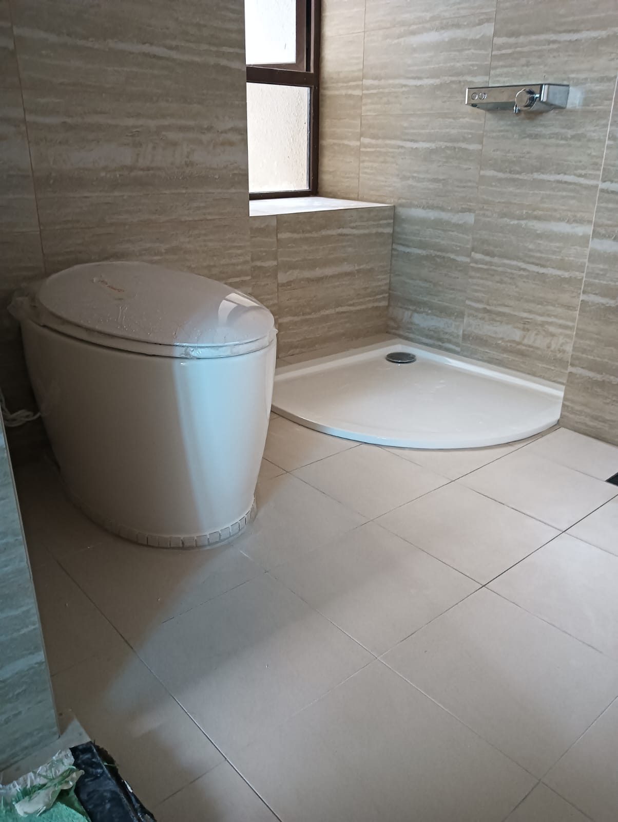 Finished toilet with new tiles and fittings